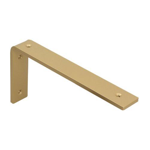 Μία χρυσή ματ μεταλλική γωνία για ράφι φωτογραφισμένη σε λευκό φόντο